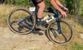 Tufo-Gravel-Thundero-tubeless-gravel-bike-tires_affordable-durable-mixed-surface-grip_review-riding-sandstaone-and-grass.jpg